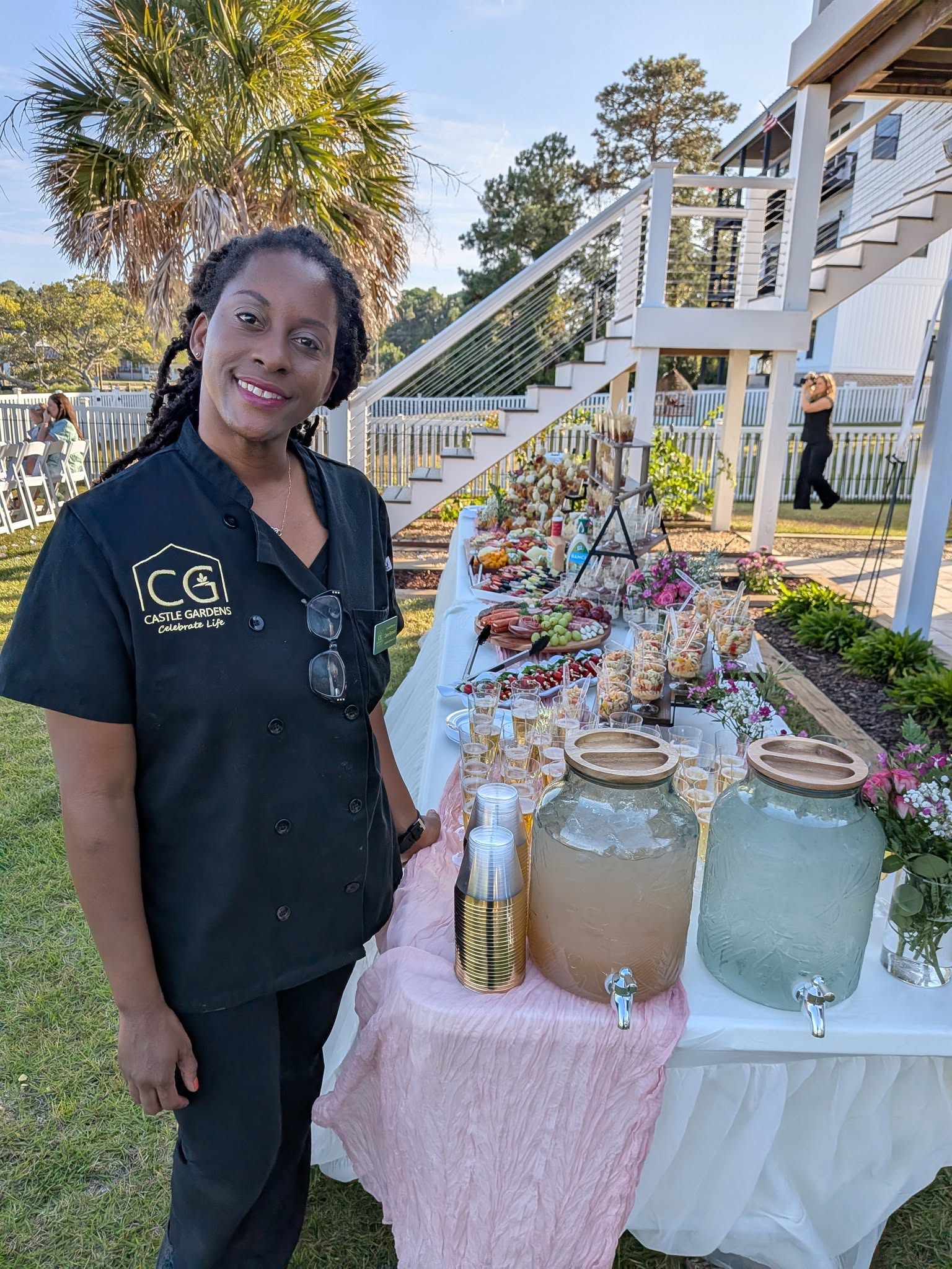 Luxury wedding table décor with greenery, glassware, and gold accents near Brunswick Forest NC.